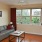 living room with a couch, coffee table, and large window