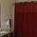 bathroom with shower and large mirror